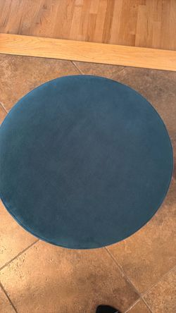 Round teal velvet ottoman
