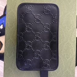 Gucci Black Embossed GG toiletry bag $750