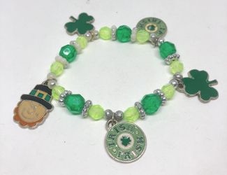 Children bracelet in green color with St Patrick’s themed charms
