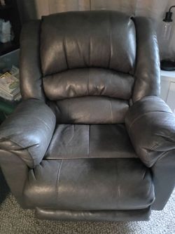 2 brown leather chairs