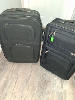 One medium and one large suitcases