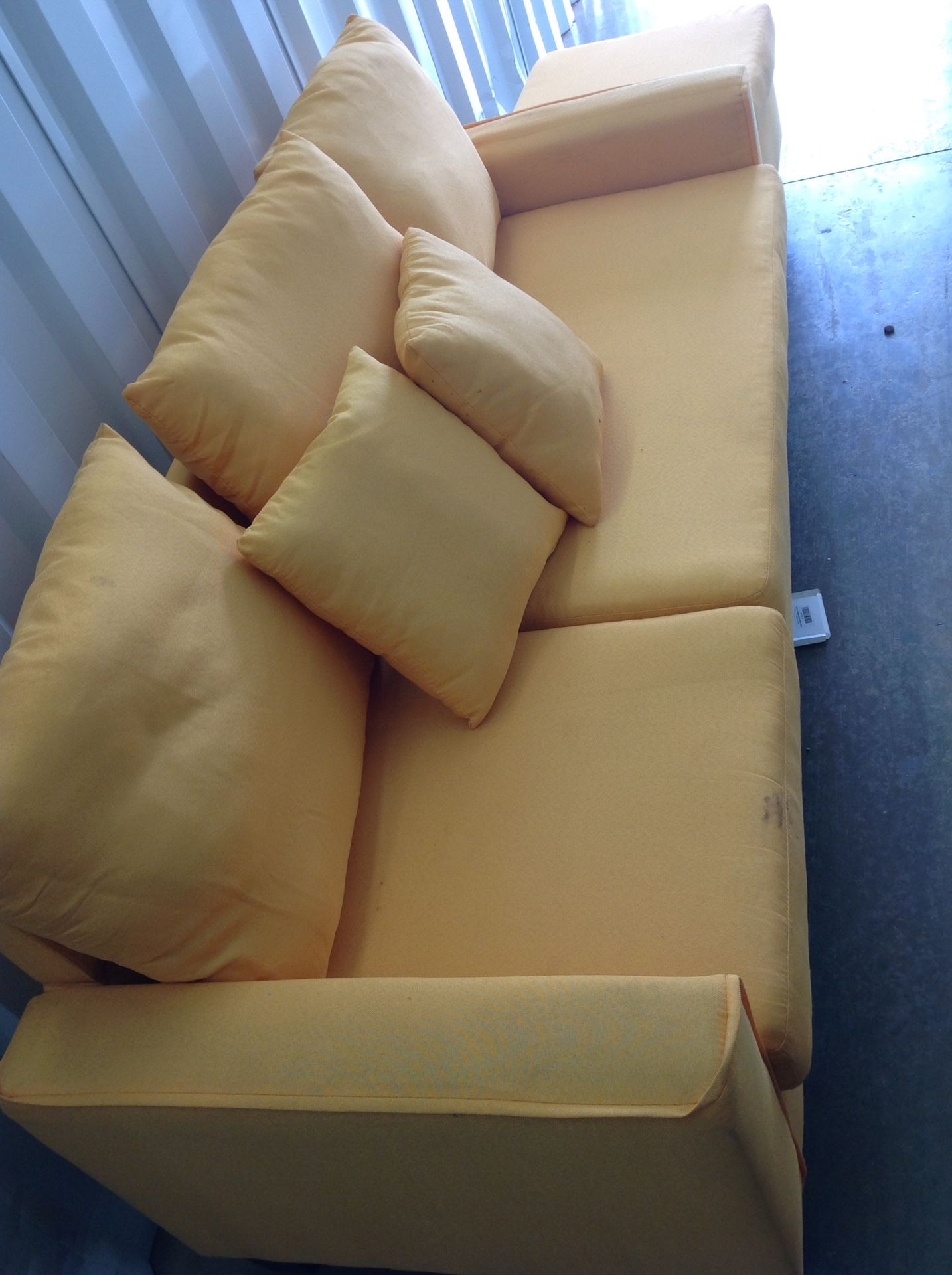 Yellowish/orangish sofa and foot stool