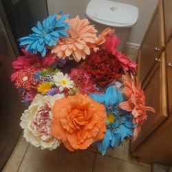 Vibrant mix of artificial flowers in various colors.