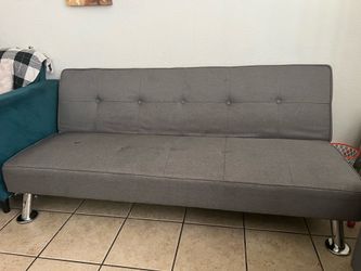 Grey futon with brown cover