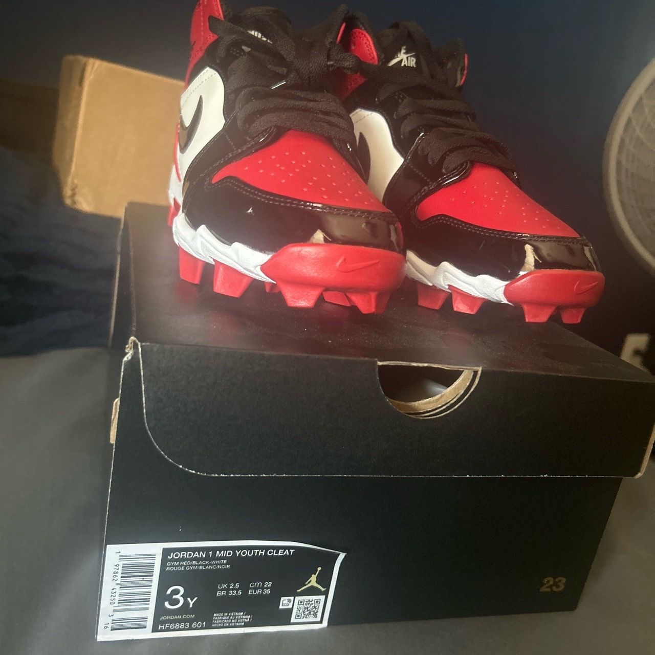 Kid’s Red Nike football cleats