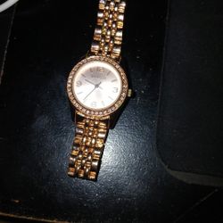 Valette women's rose gold-tone watch with a crystal-accented bezel and bracelet. 