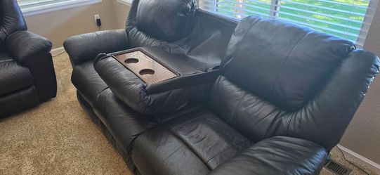 Italian leather couch with loveseat. Both powered recliners.