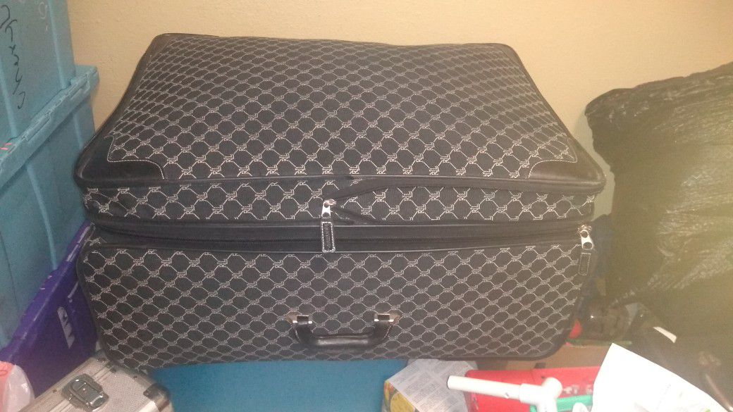 American eagle suitcase stuffed with clothing