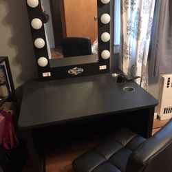 Makeup table with light mirror & chair. Excellent condition. Also have New replacement parts and draw.