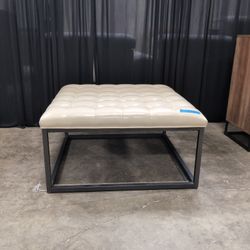 Cream Tufted Faux Leather Ottoman with Metal Base