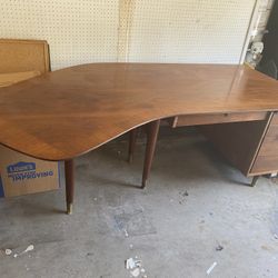 Vintage Mid-Century Modern Wooden Desk with a Unique, Asymmetrical Design.