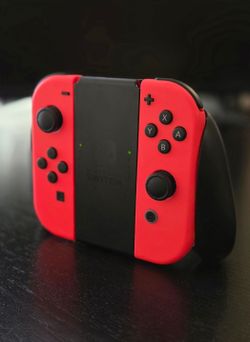 NINTENDO SWITCH NEON RED OEM  JOYCONS  WITH JOYCON GRIP