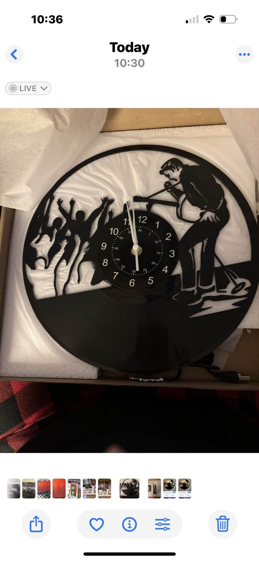Elvis vinyl record wall clock featuring a jazz or rock music performance silhouette design