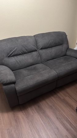 Loveseat with recliner on both sides