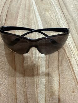 Condor safety glasses featuring dark gray or tinted polycarbonate lenses and black