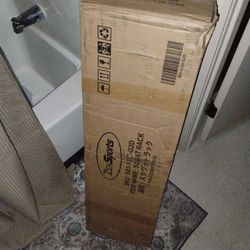 squat stands in box. 5ft Olympic barbell in box.leg curl extension machine in box ab/ back machine disassembled.