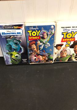 3 vhs tapes. Monsters inc. toy story and toy story 2
