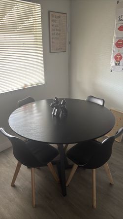 Round 45” black wooden tabletop with black metal legs
