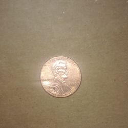 2009 Man Sitting On A Log Penny 