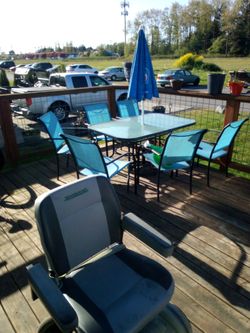 Patio table 6 blue chair,s umbrella stand and umbrella and table cloth