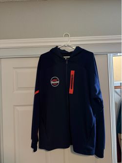 navy blue zip up hoodie with orange accents