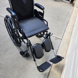 DRIVE.  Wheelchair, black,wheel locks,removable foot rests, removable seat cushion. 