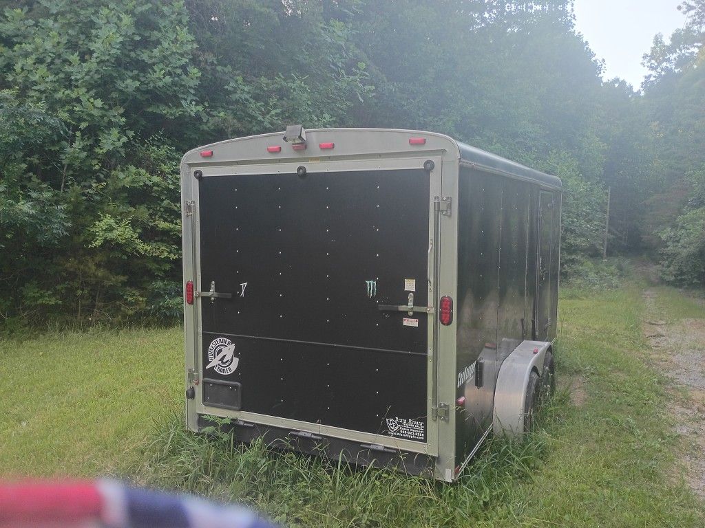 16 Foot Double Axel Homesteader Enclosed Pull Behind Trailer.