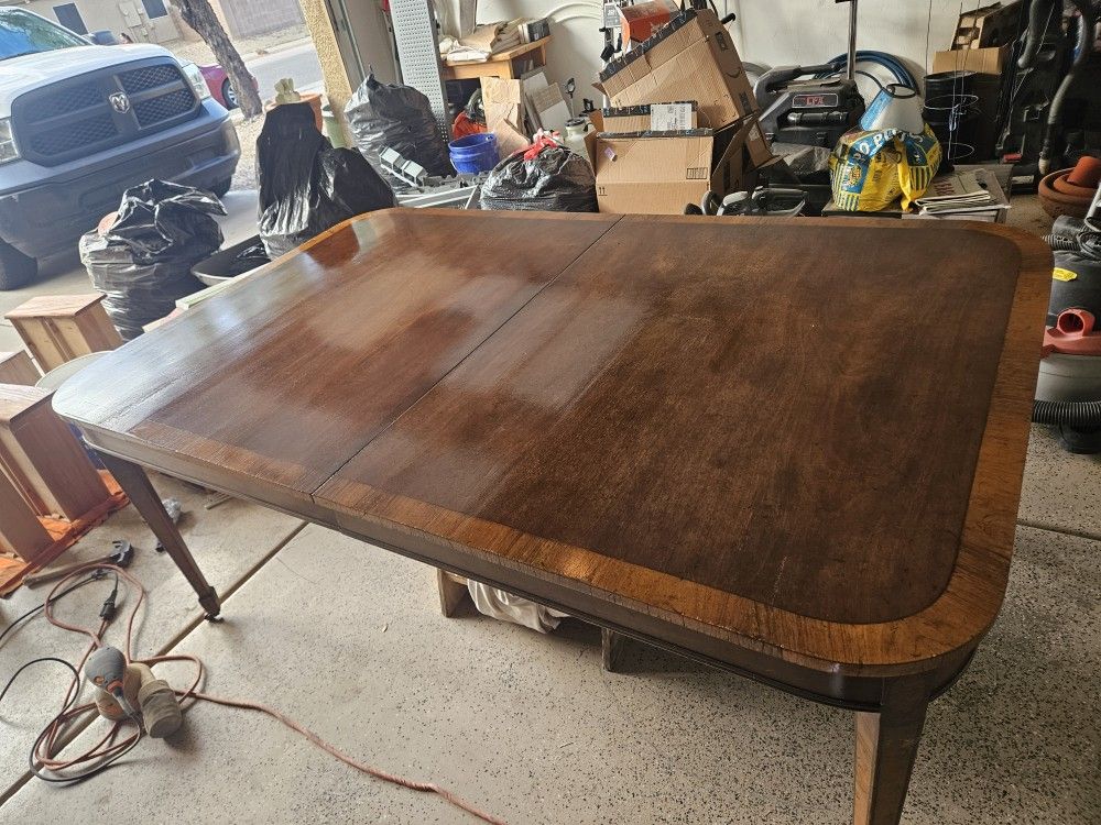 Kitchen Table.  60 Inches Long.  45 Inches Wide. 30 Inches High. Just got finished detailing it with two coats of clear lacquer on top cast iron wheel