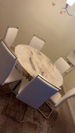 Round marble dining table with 6 chairs