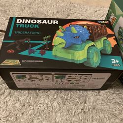 TEMI Dinosaur Truck Toy for Kids 3-5 Years, Triceratops Transport Car Carrier Truck with 8 Dino Figures, Activity Play Mat, Dino Eggs and Trees, Captu