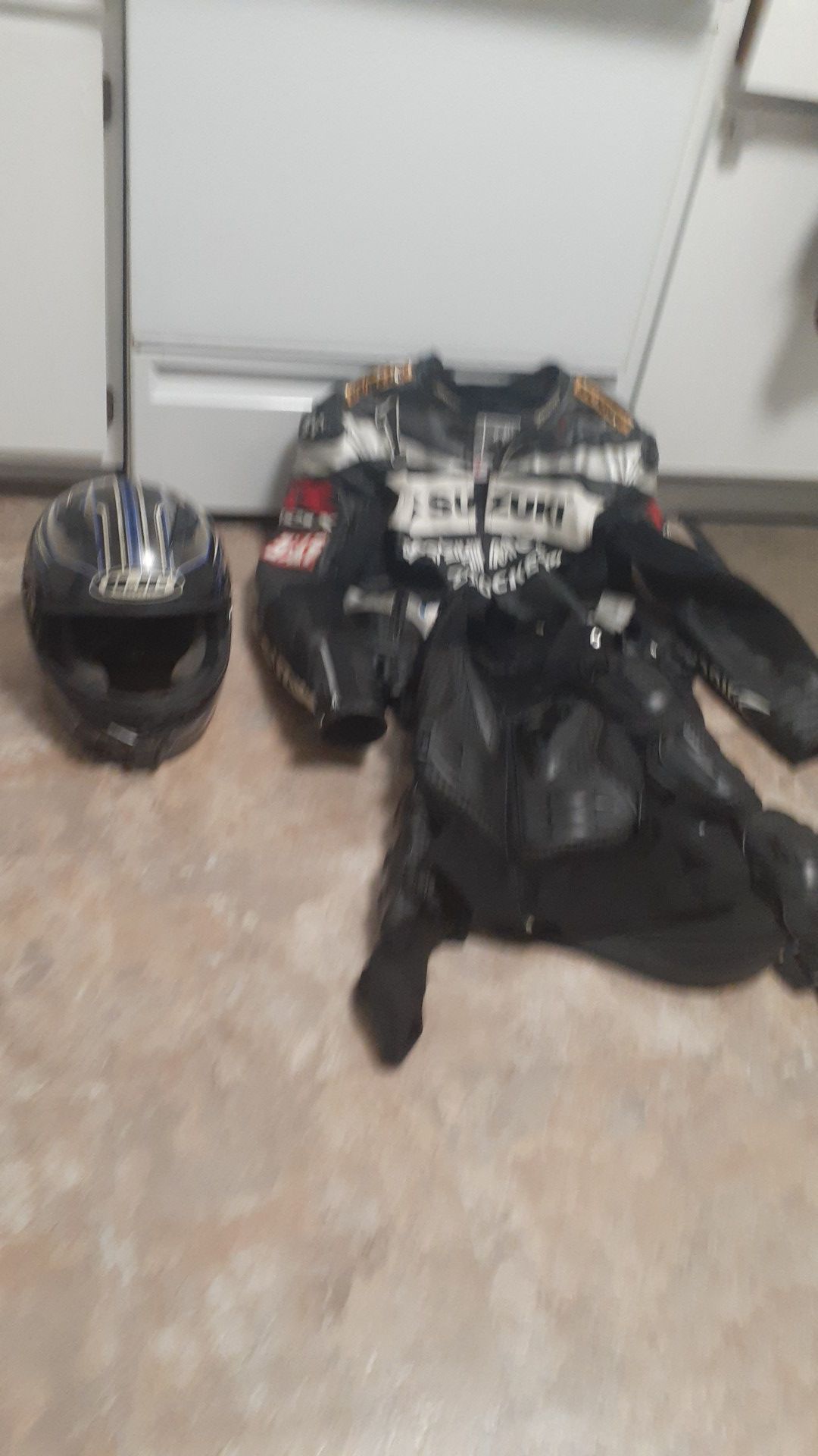 Motorcycle jacket with helmet