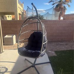 Eggchair with frame and sunbrella cushion like new