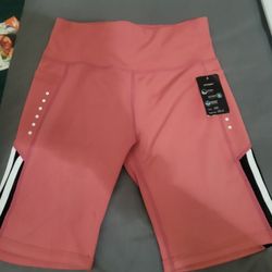 NEW WITH TAG WORKOUT COLOR: CORAL  SHORTS WITH POCKETS  SIZE: S/M  For $10