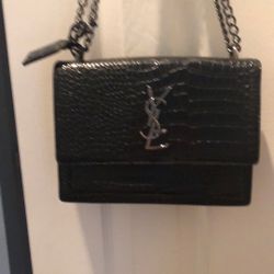 YSL Embossed Leather https://offerup.com/redirect/?o=QmFnLk5ldw==