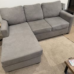 Gray Couch With Reversible Chaise