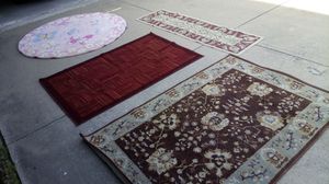Photo All 4 rugs for $20. 5 ft to 6 ft