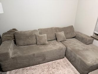 A nice peige to tan sectional used for 6 months