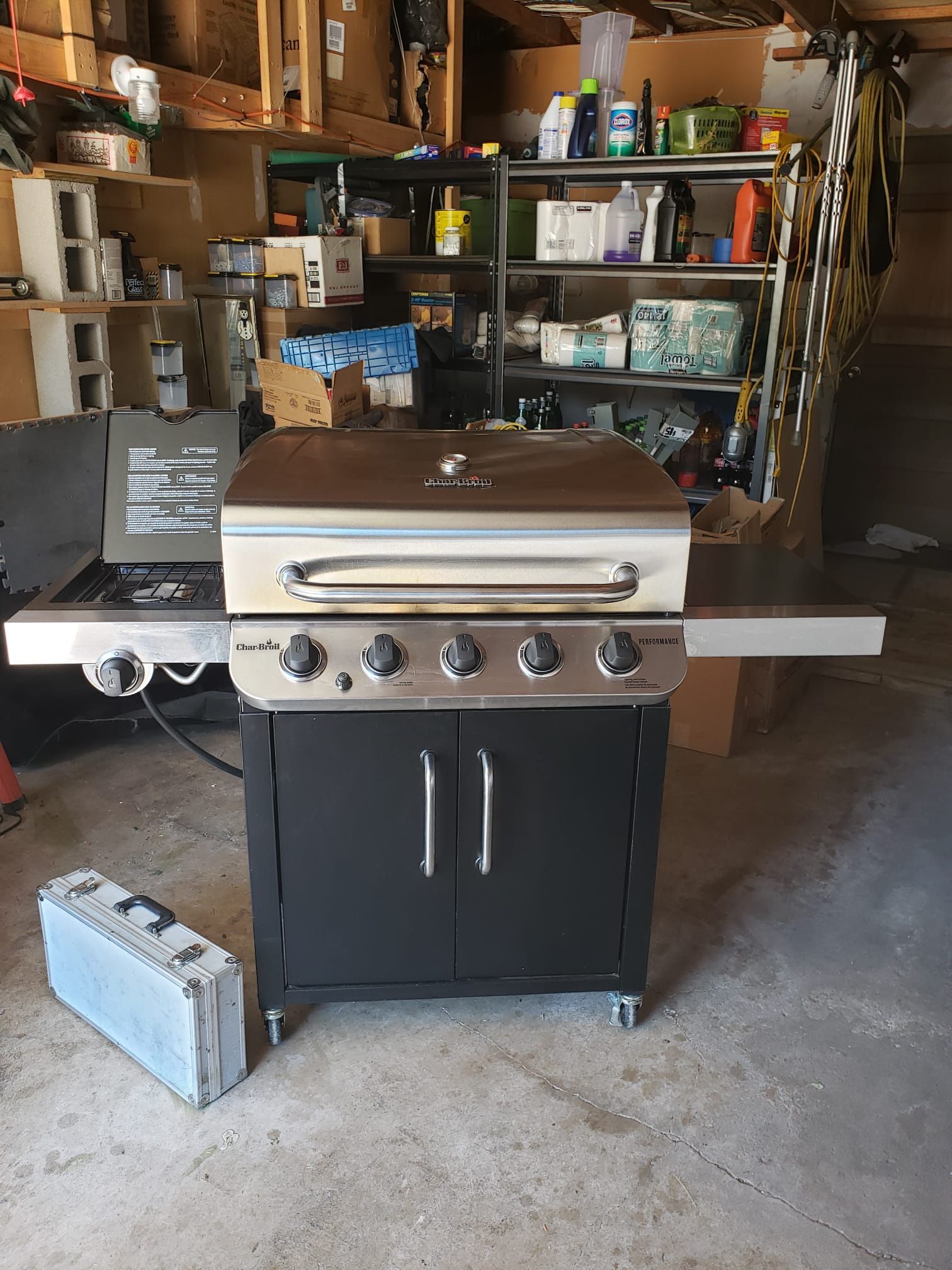 CharBroil gas grill w side burner and cover on wheels - w utensils propane tank - close to Peterson