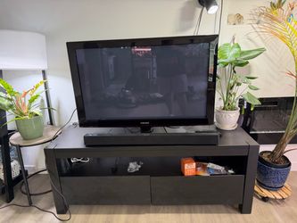 TV stand, soundbar and TV