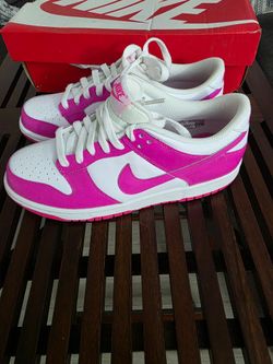 Nike Dunk Low GS "Laser Fuchsia" (Style Code: FB9109-102), featuring a white leather upper with vibrant Laser Fuchsia pink overlays, Swoosh, and outso