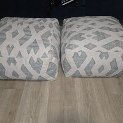 YES THEY ARE AVAILABLE 
Nice New Set of Ashley Ottomans
