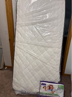 Brand new twin mattress and bedframe