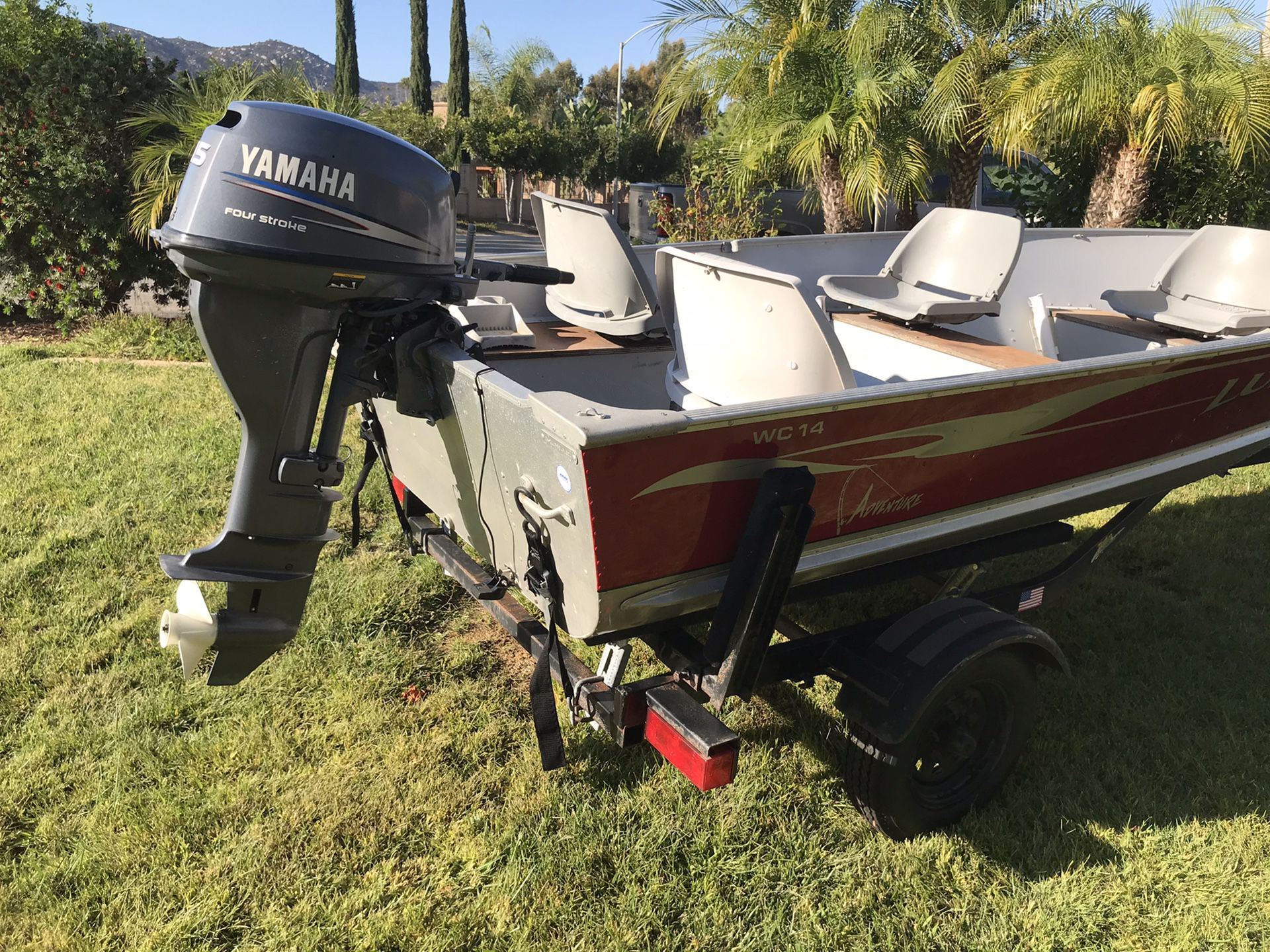 Lund WC-14 Boat with 15 HP motor and Zeman trailer - all 2004. Excellent condition with new trailer tires, gas tank, gas line and liner inside boat -