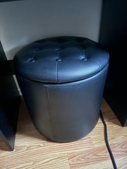 Black round leather ottoman with storage