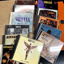 90's Rock CDs +Hand signed CDs(Mudhoney, Meat Puppets and Tom Morello)+ Nirvana's LiveDVDand some Rear CDs part1