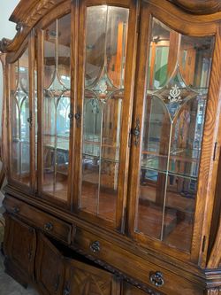 Vintage china cabinet and table with 10 hard wood chairs!