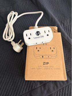 NEW IN BOX This is a "ZIP" branded 5-foot power strip with AC outlets, USB-A, and USB-C ports, customized with a Lawyers Title logo.