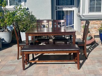 Dining table with 4 chairs and a bench