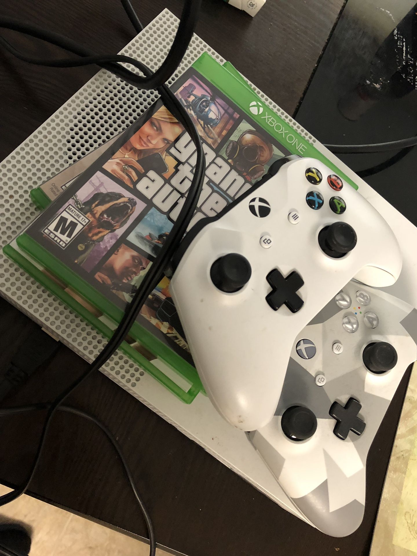 Xbox one package with 2 wireless controllers and games.