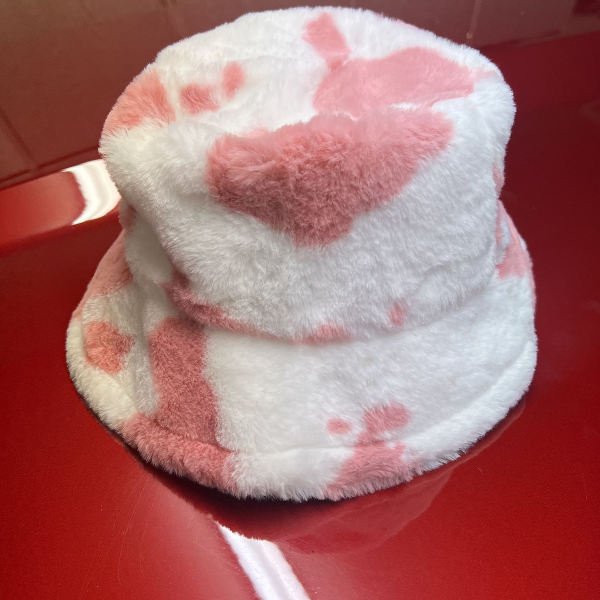 Pink cow fuzzy bucket hat